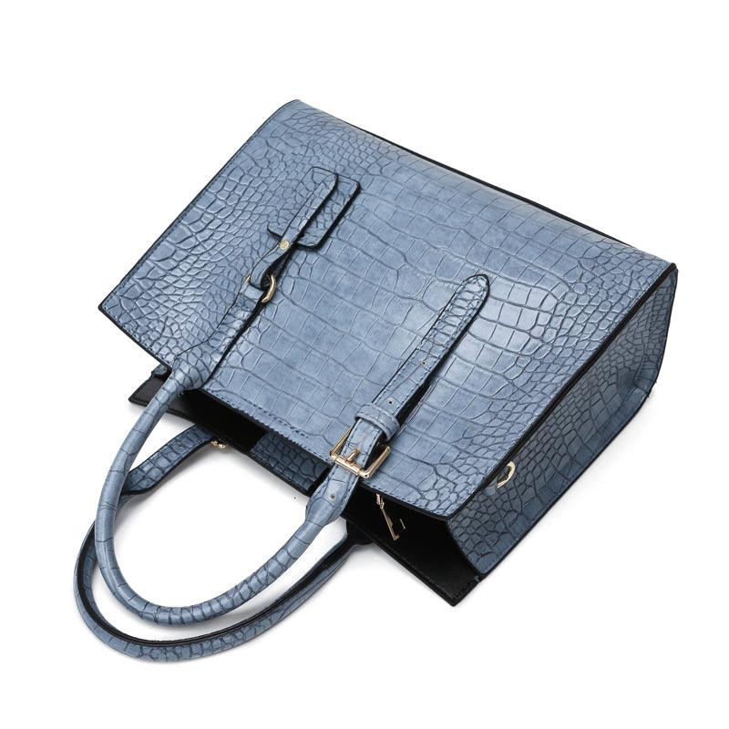 Bolsa de Couro com Estampa de Cobra. - Lindas & Cia Shop